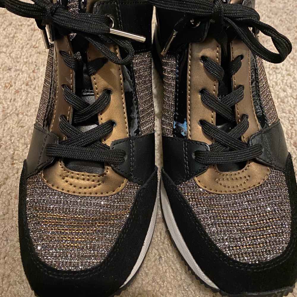 Micheal Kors wedge heel sneaker. Size 6.5. Barely worn.